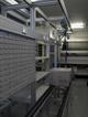 Workstation with integrated conveyor, parts bins, machine guarding, power and compressed air